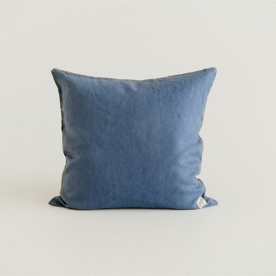 in a bedroom with Coastal Blue Cushion Cover.