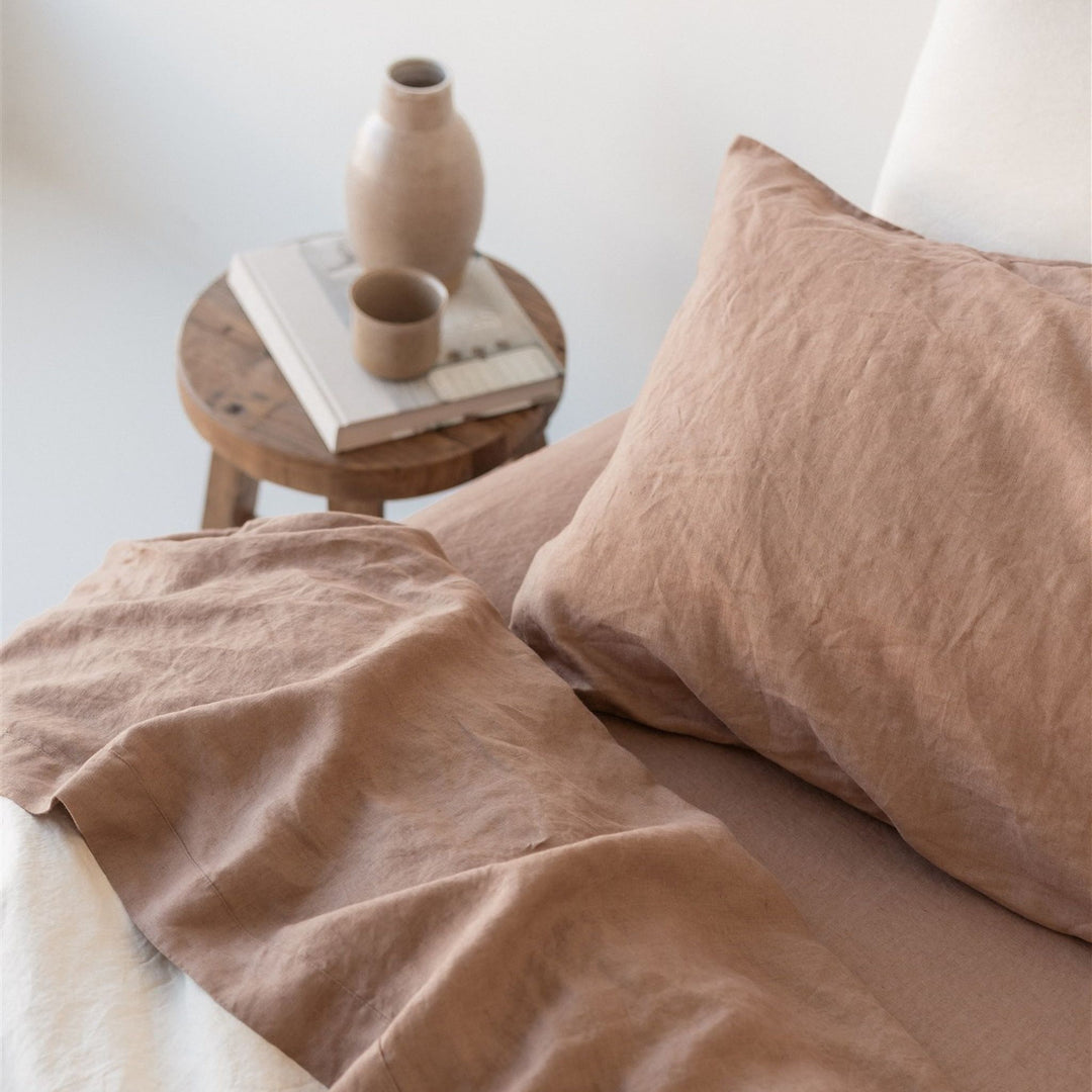 Foxtrot Home French Flax Linen styled with Malt Brown Sheets and an Oat Duvet