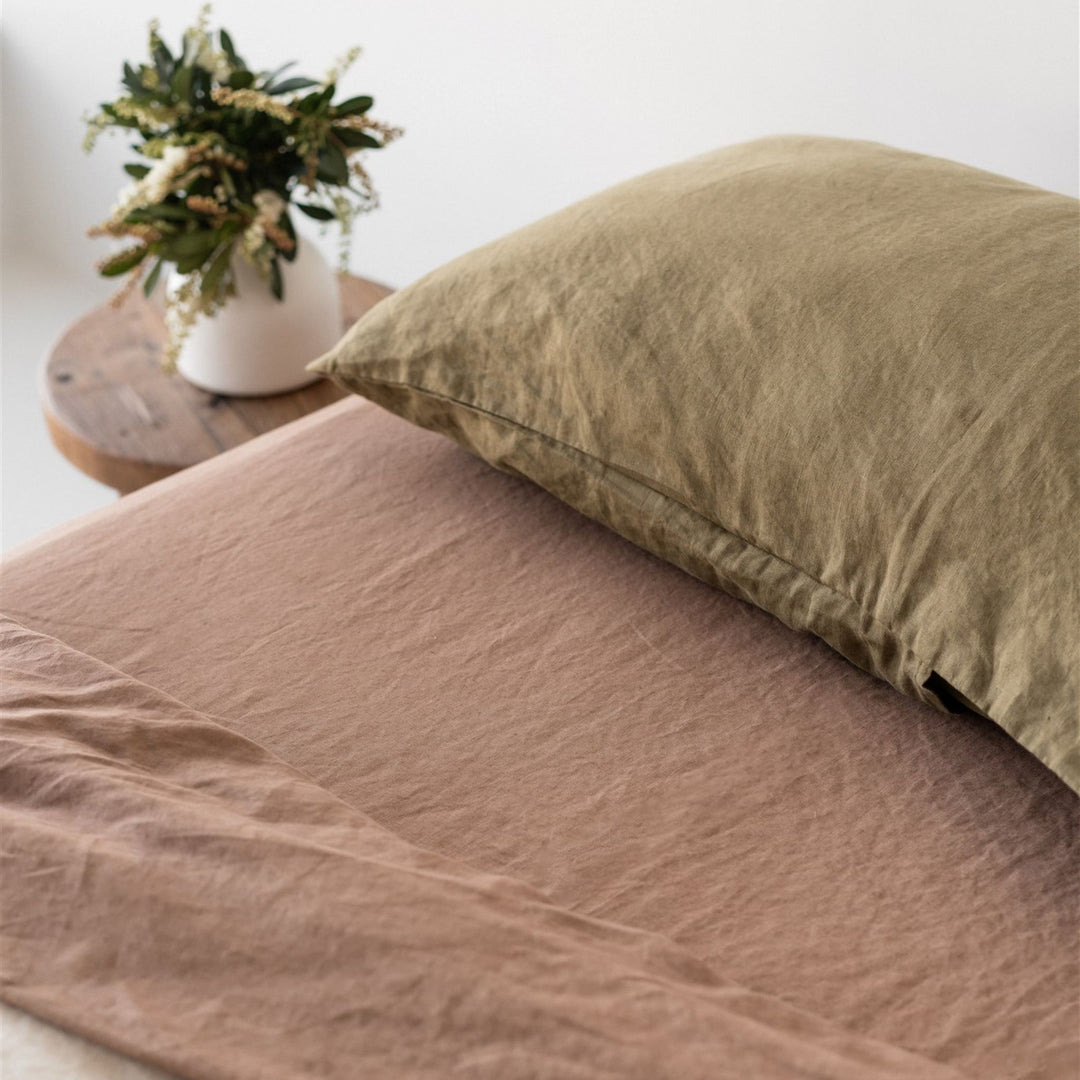 Foxtrot Home French Flax Linen styled with Malt Brown Sheets and an Olive Pillowcase