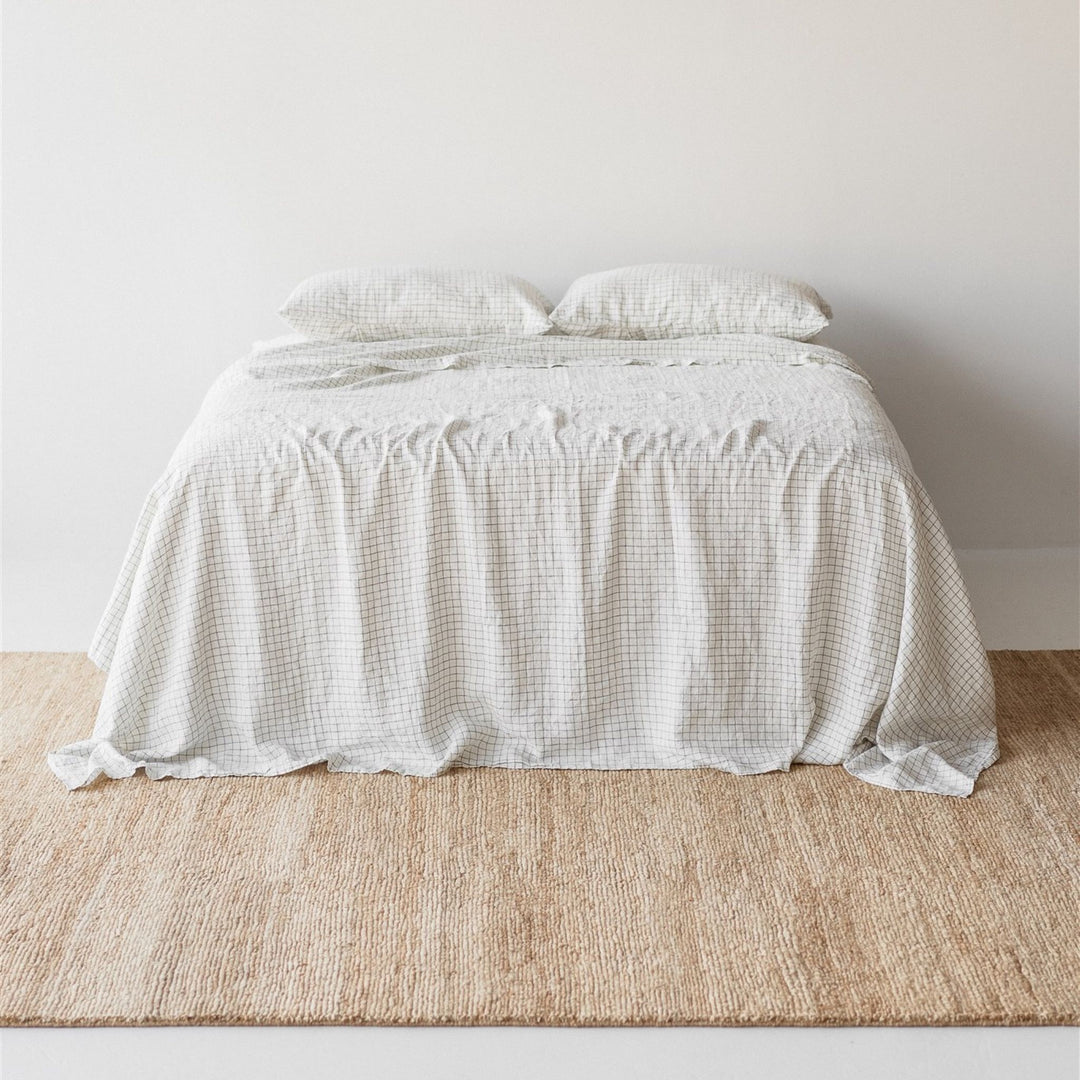 Foxtrot Home French Flax Linen styled in a bedroom with Cactus Grid Fitted Sheet.