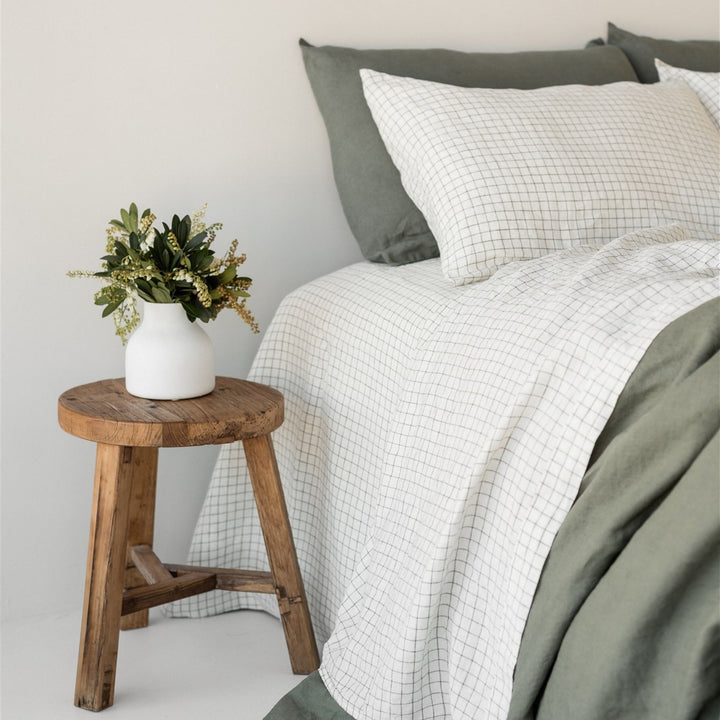 Foxtrot Home French Flax Linen styled in a bedroom with Cactus Grid Fitted Sheet.