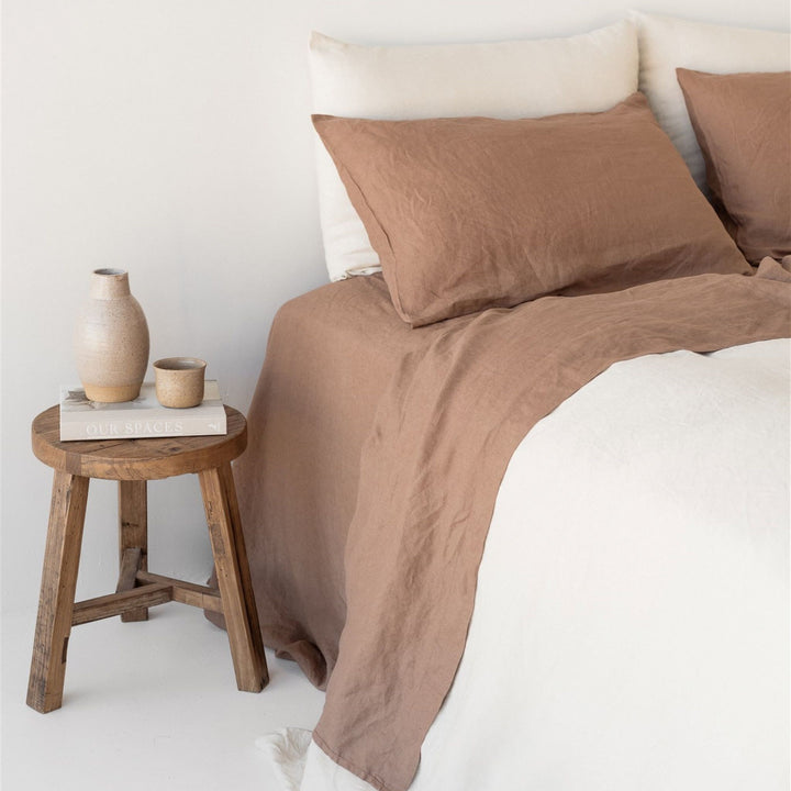 Foxtrot Home French Flax Linen styled with Malt Brown Sheets and an Oat Duvet