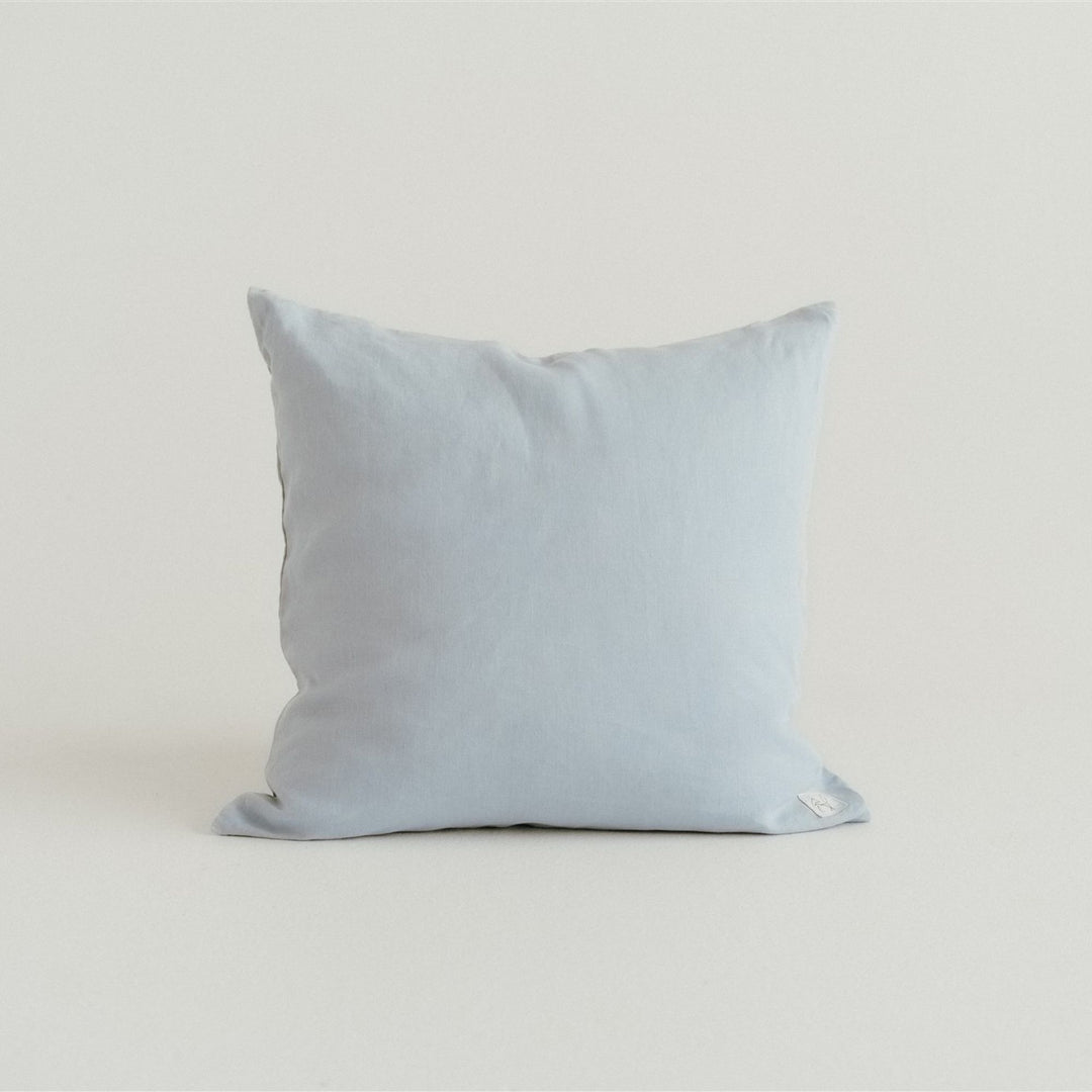 Foxtrot Home French Flax Linen styled in a bedroom with Powder Blue Cushion