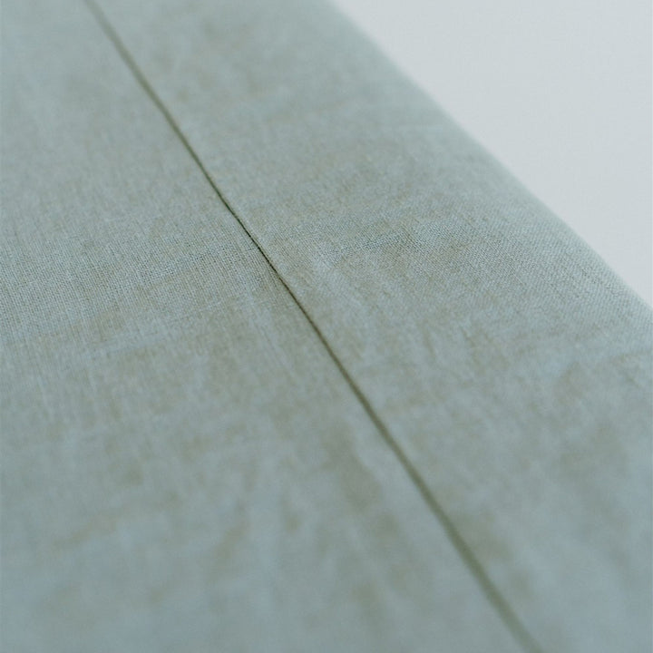 Foxtrot Home French Flax Linen styled in a bedroom with a Sage Green Bedspread