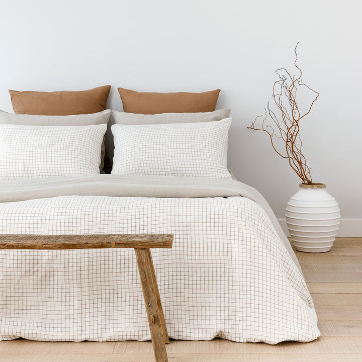 Foxtrot Home French Flax Linen styled with Malt Brown Grid Duvet and Natural Sheets
