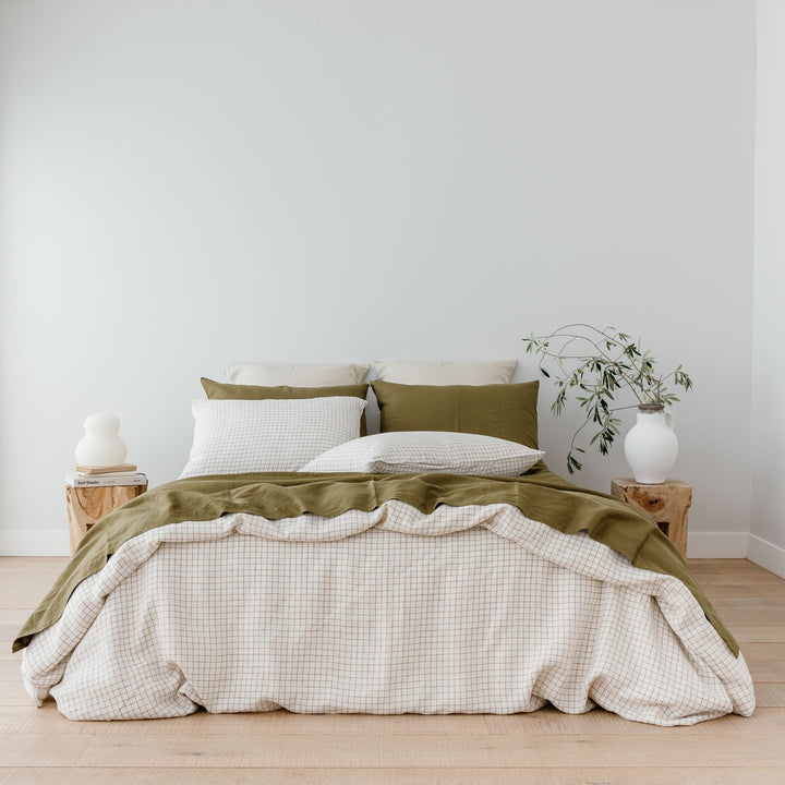 Foxtrot Home French Flax Linen styled with Malt Brown Grid Duvet and Olive Sheets