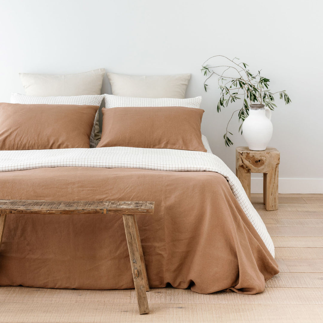 Foxtrot Home French Flax Linen styled with Malt Brown Grid Sheet Sets and a Malt Brown Duvet