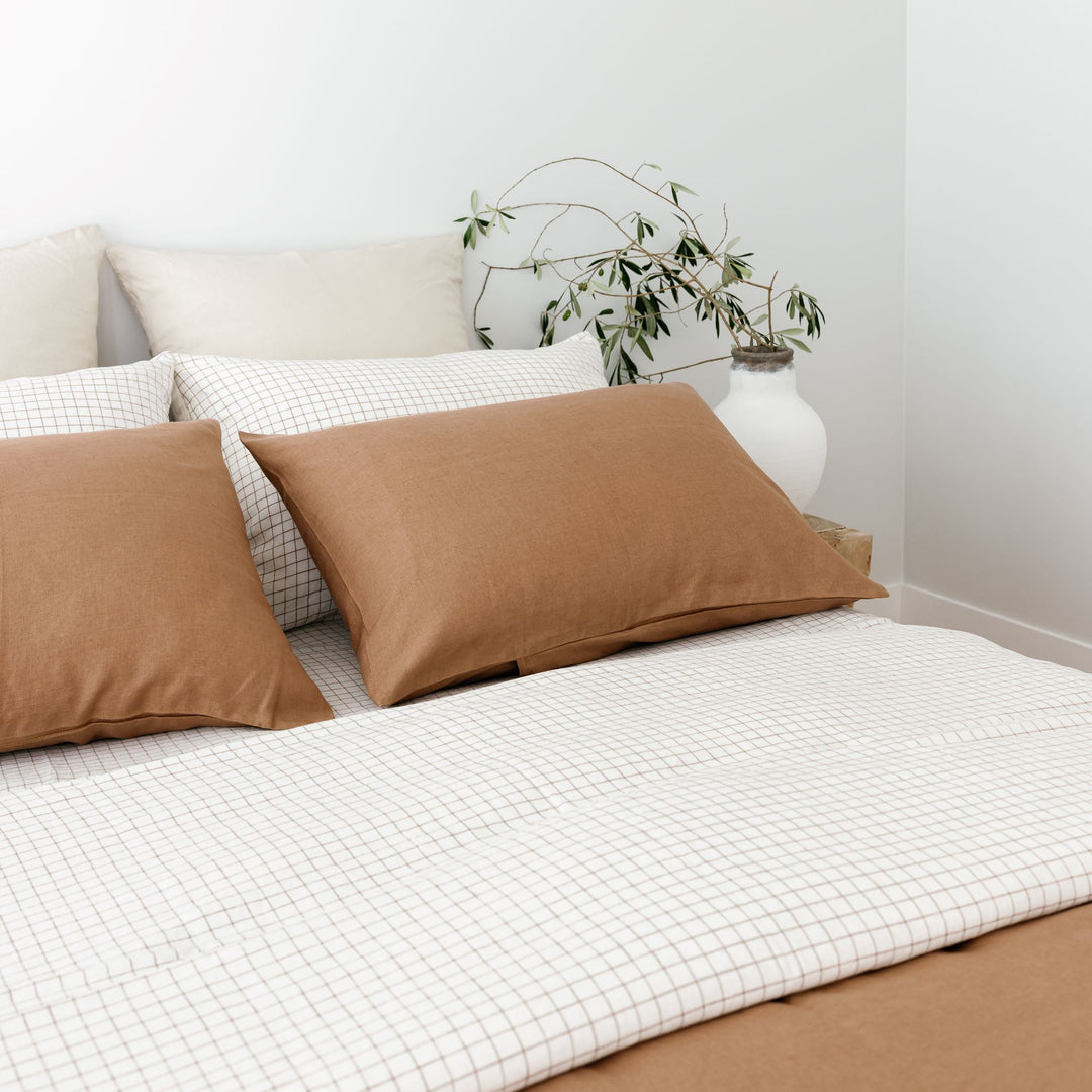 Foxtrot Home French Flax Linen styled with a Malt Brown Grid Duvet with Malt Brown Pillowcases