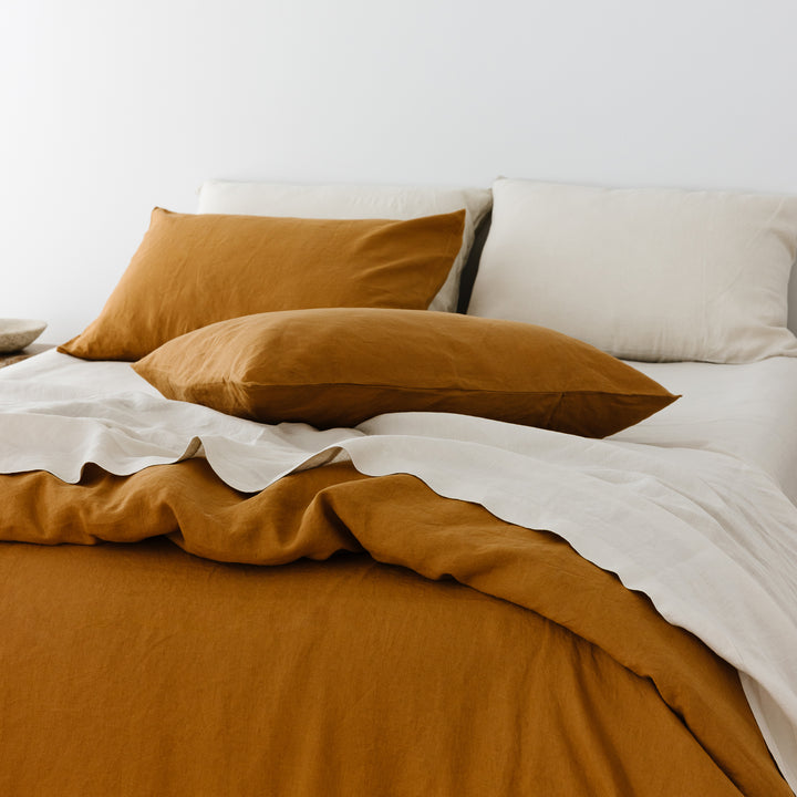 Foxtrot Home French Flax Linen Oat Sheet Sets styled in a bedroom.