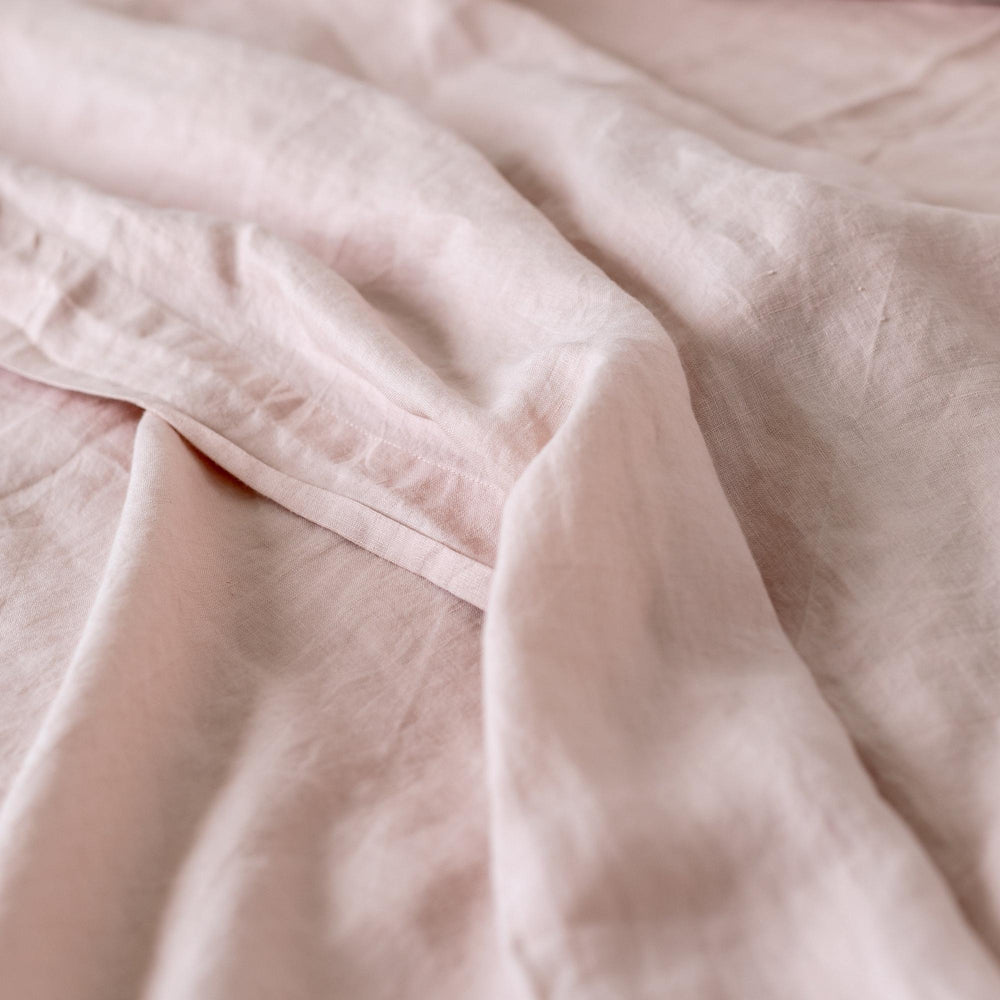 Foxtrot Home French Flax Linen styled in a baby's bedroom with a Blush Pink Cot Duvet.