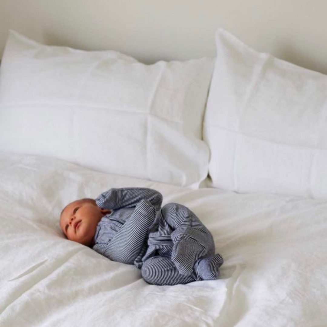 Foxtrot Home French Flax Linen styled in a bedroom with Brilliant White Duvet and Pillowcases.