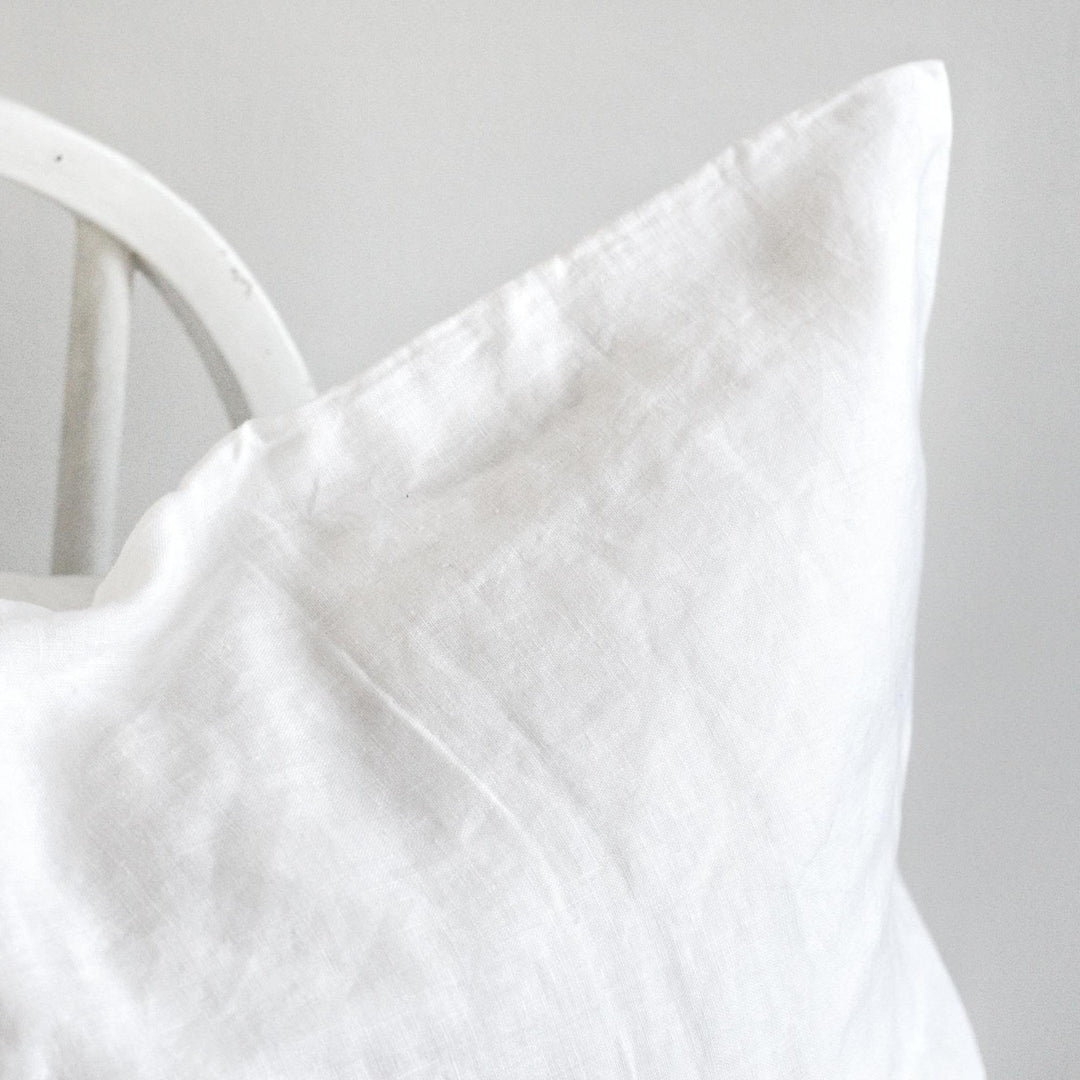 Foxtrot Home French Flax Linen styled in a bedroom with Brilliant White Pillowcases.