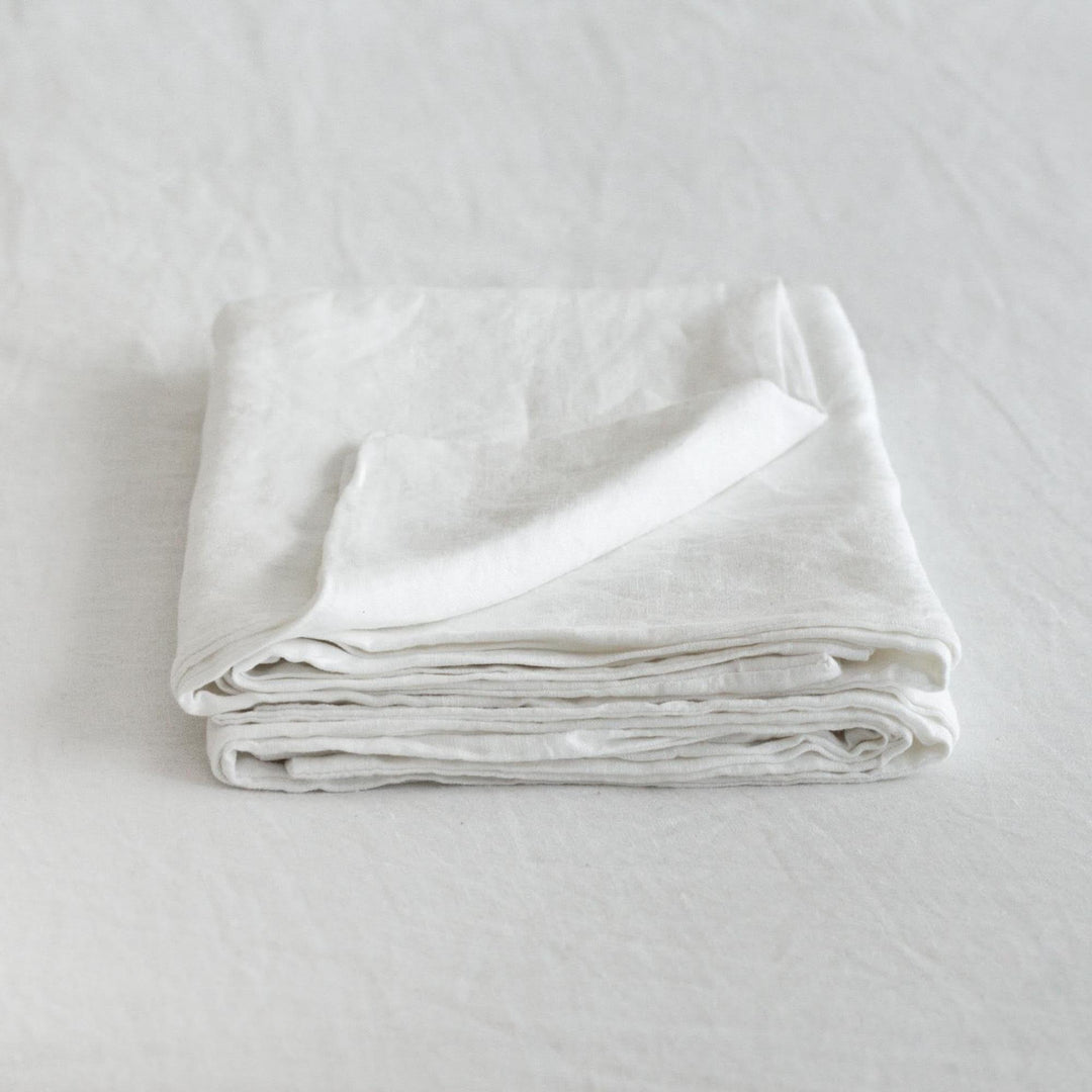 Foxtrot Home French Flax Linen styled in a bedroom with Brilliant White Pillowcases.