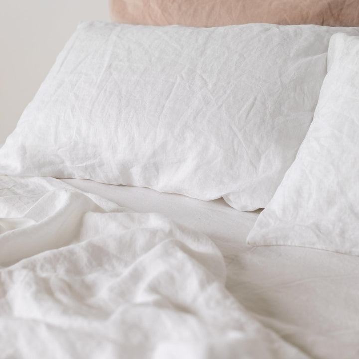 Foxtrot Home French Flax Linen styled in a bedroom with Brilliant White Pillowcases.