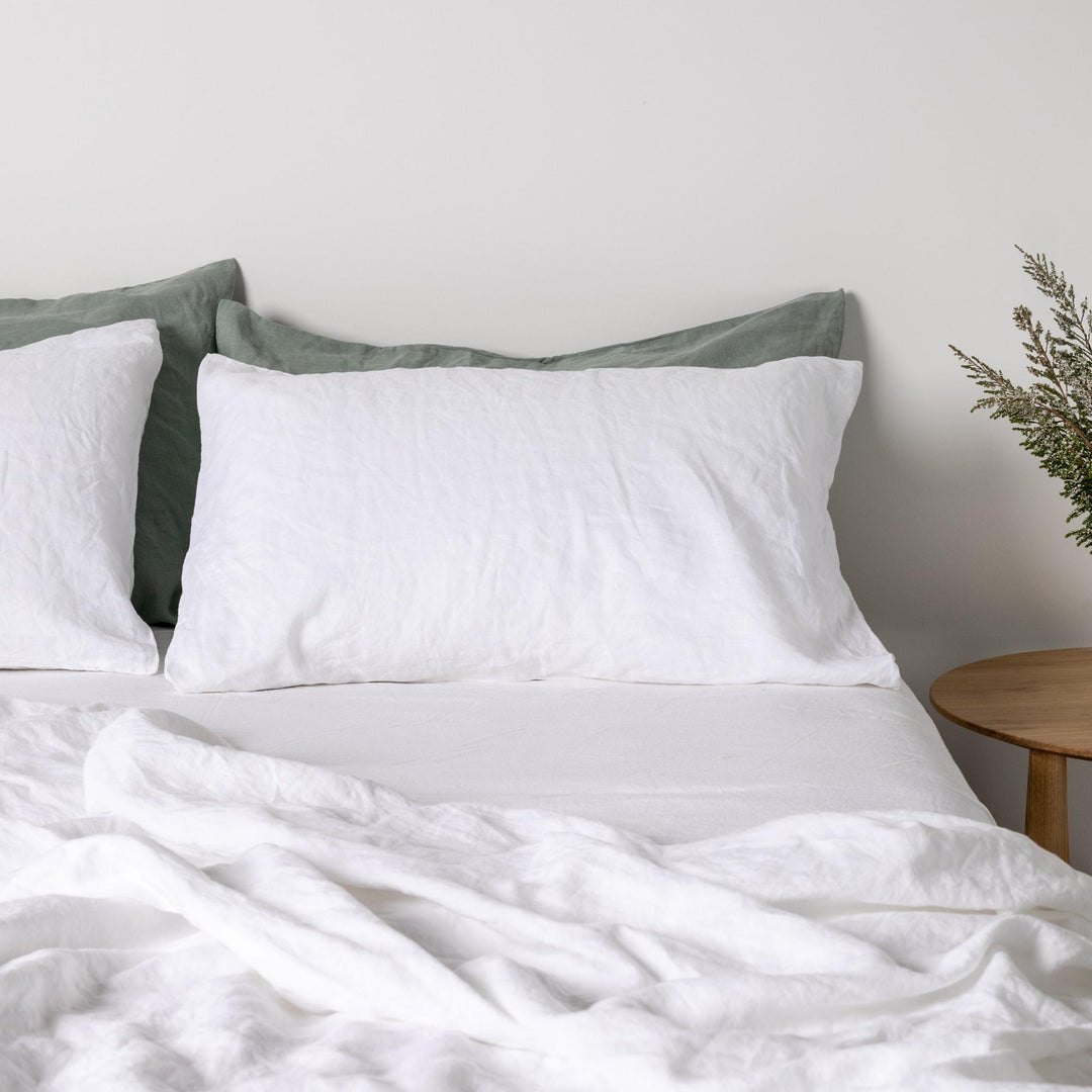 Foxtrot Home French Flax Linen styled in a bedroom with Brilliant White Pillowcases.