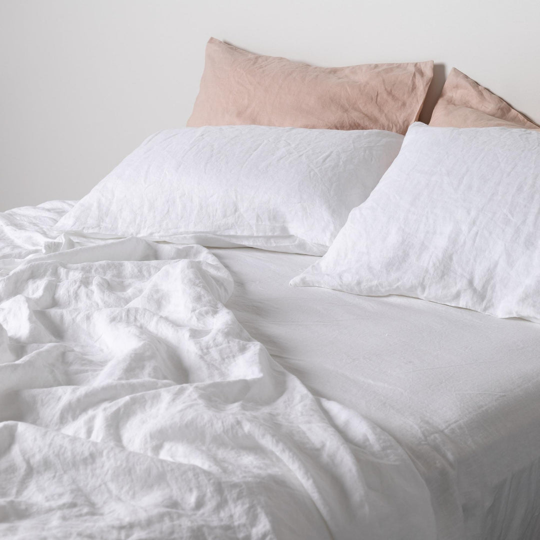 Foxtrot Home French Flax Linen styled in a bedroom with Brilliant White Pillowcases.