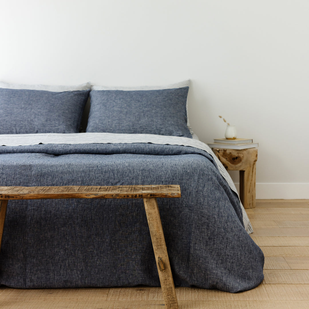 Foxtrot Home French Flax Linen styled in a bedroom with Denim Blue Duvet.