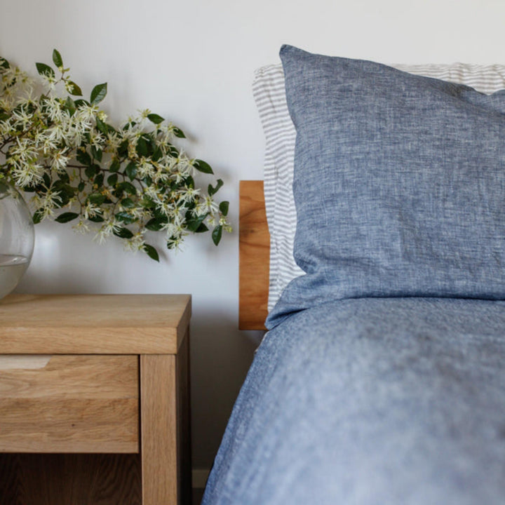 Foxtrot Home French Flax Linen styled in a bedroom with Denim Blue Duvet.