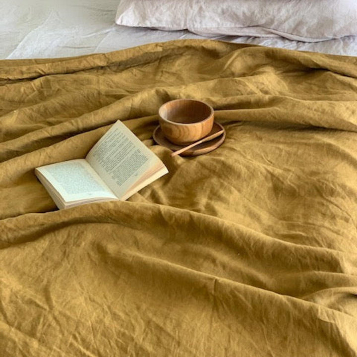 Foxtrot Home French Flax Linen styled in a bedroom with Ginger Honey Duvet.
