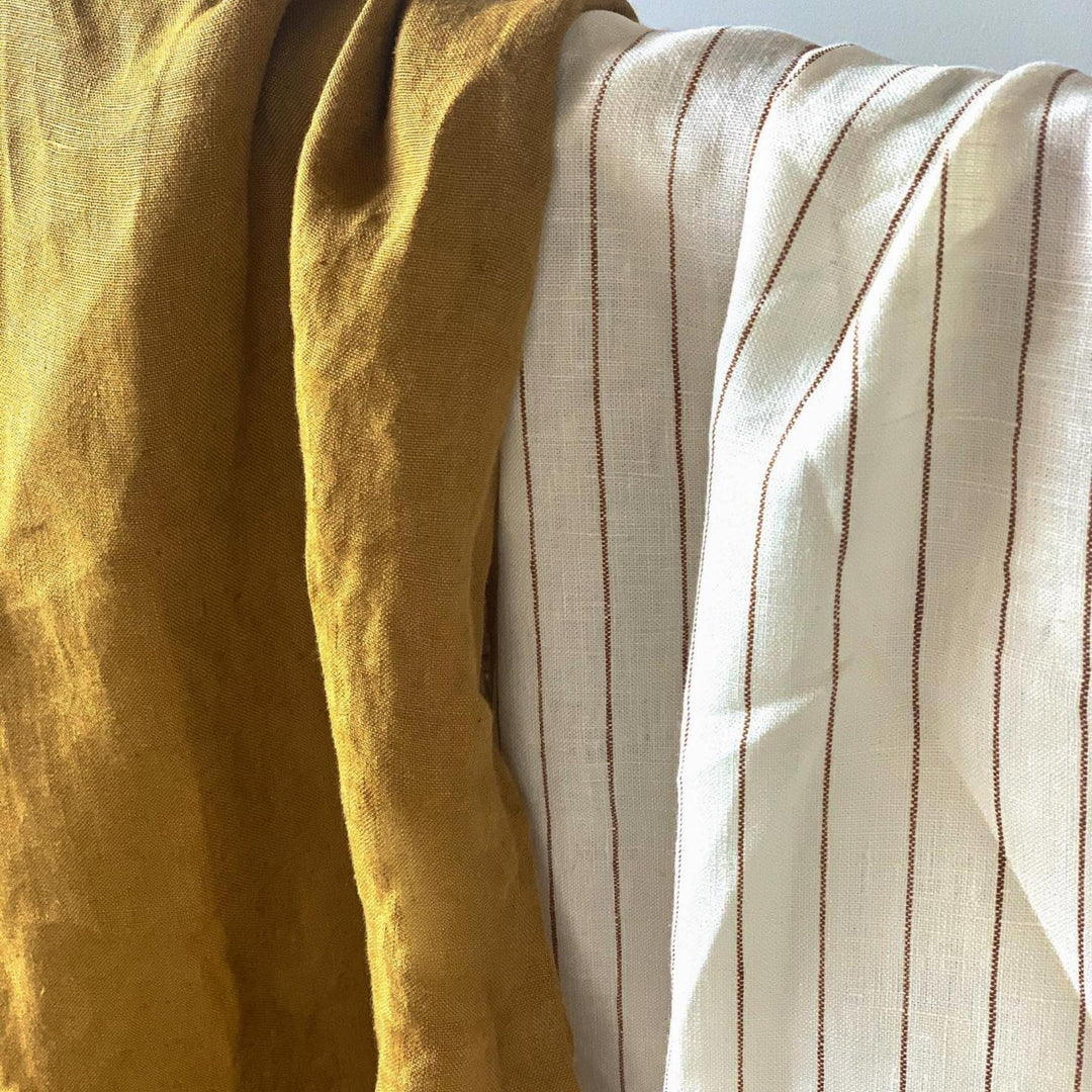 Foxtrot Home French Flax Linen styled in a bedroom with Honey Ginger & Tobacco Stripes Quilt.