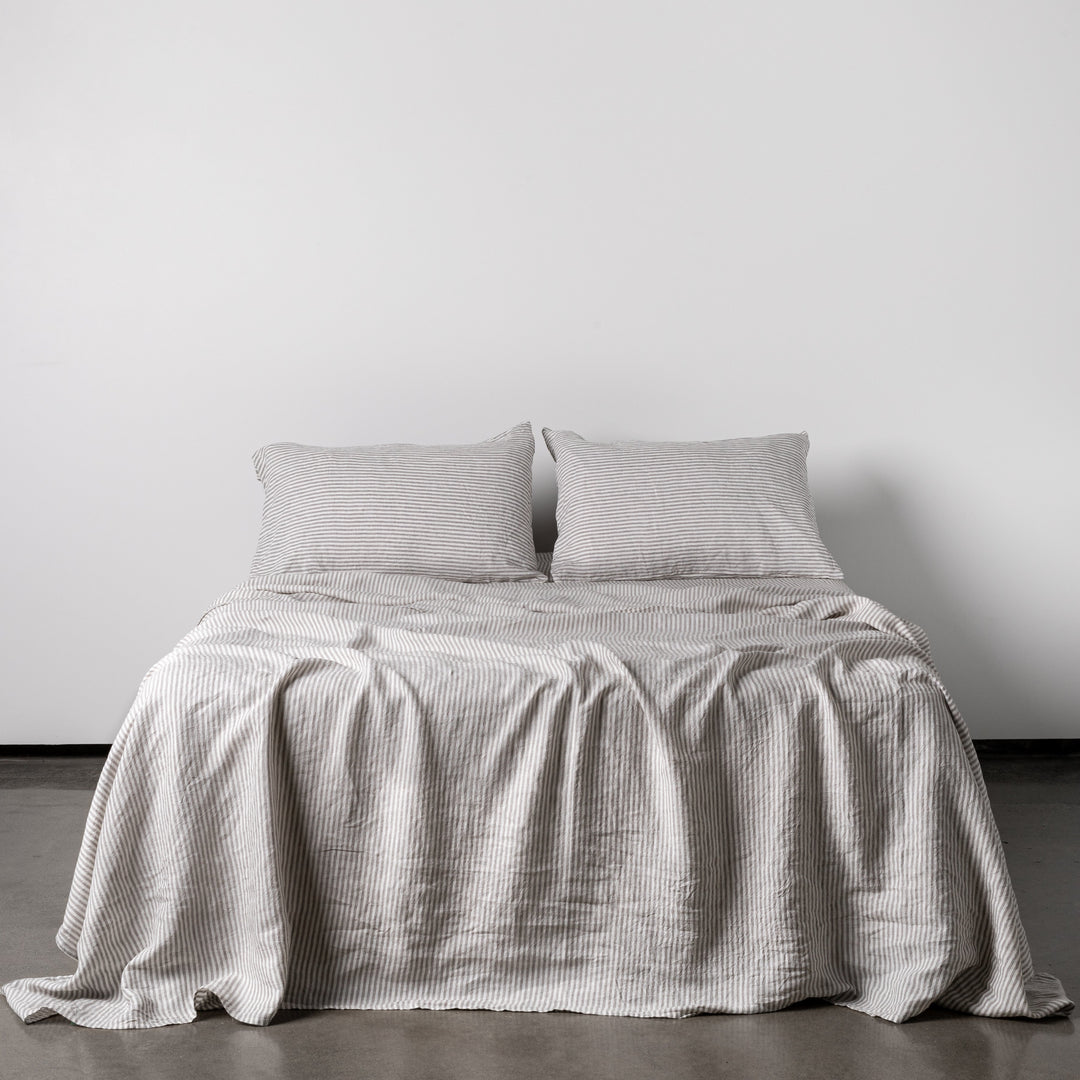 Foxtrot Home French Flax Linen styled in a bedroom with Grey Stripes Flat Sheet.
