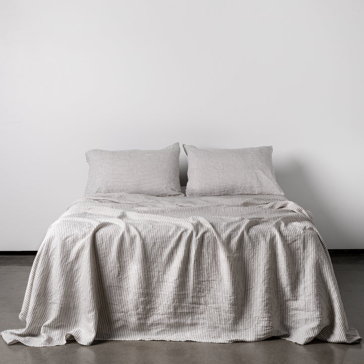 Foxtrot Home French Flax Linen styled in a bedroom with Grey Stripes Flat Sheet.