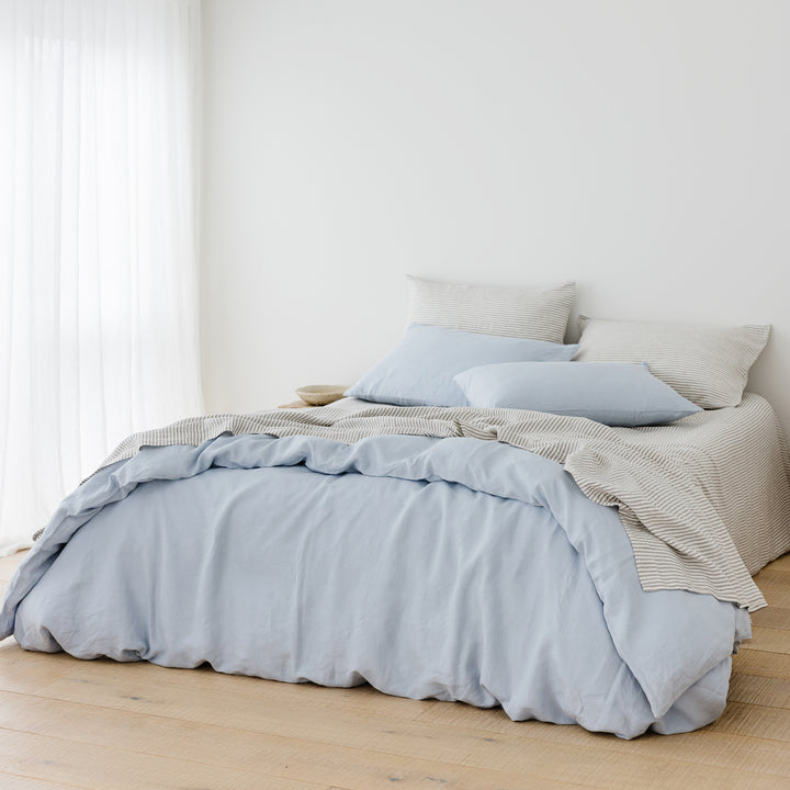 Foxtrot Home French Flax Linen styled in a bedroom with Grey Stripes Flat Sheet.