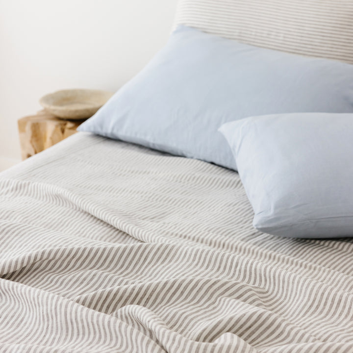 Foxtrot Home French Flax Linen styled in a bedroom with Grey Stripes Flat Sheet.