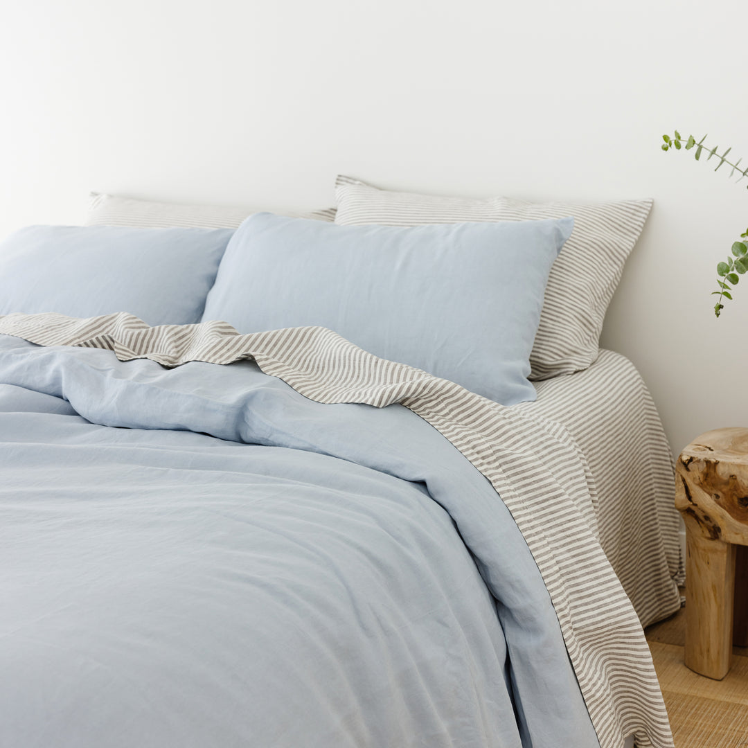 Foxtrot Home French Flax Linen styled in a bedroom with Grey Stripes Flat Sheet.