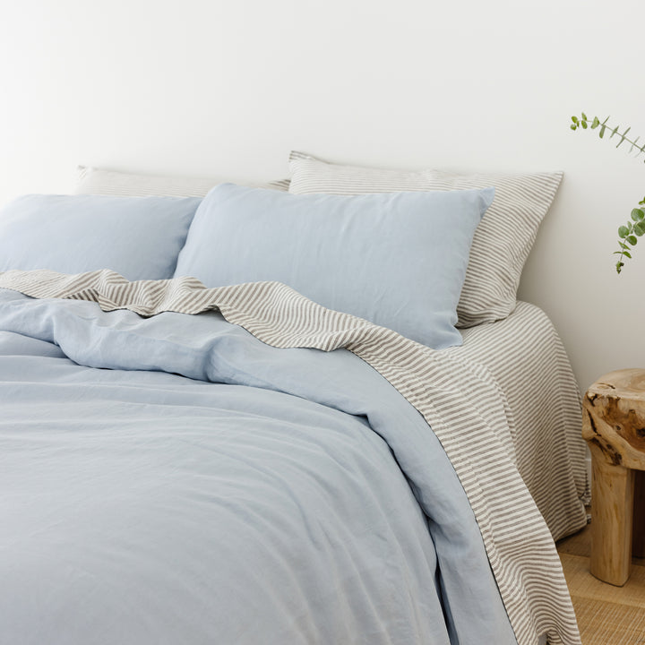 Foxtrot Home French Flax Linen styled in a bedroom with Grey Stripes Flat Sheet.