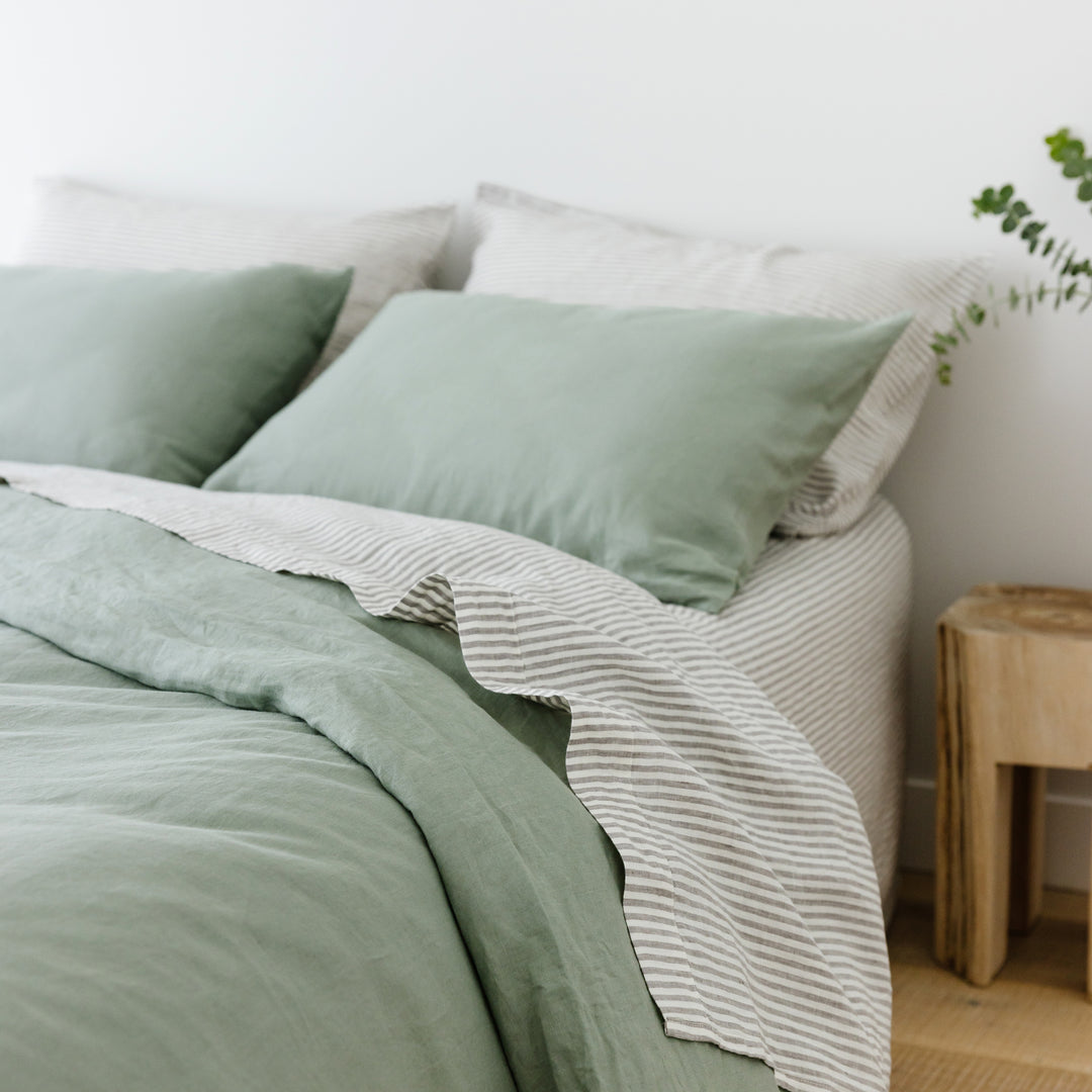 Foxtrot Home French Flax Linen styled in a bedroom with Grey Stripes Flat Sheet.