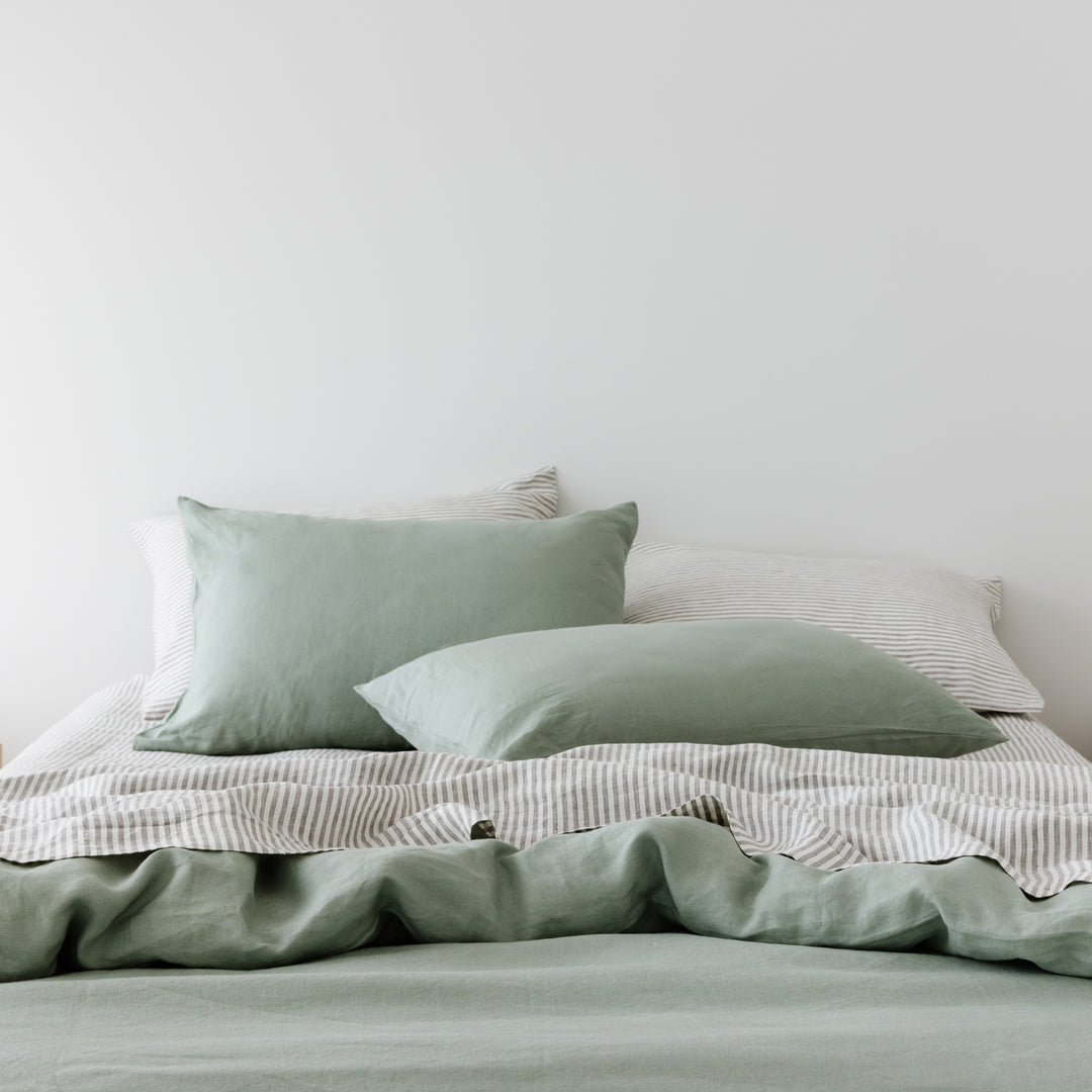 Foxtrot Home French Flax Linen styled in a bedroom with Grey Stripes Flat Sheet.