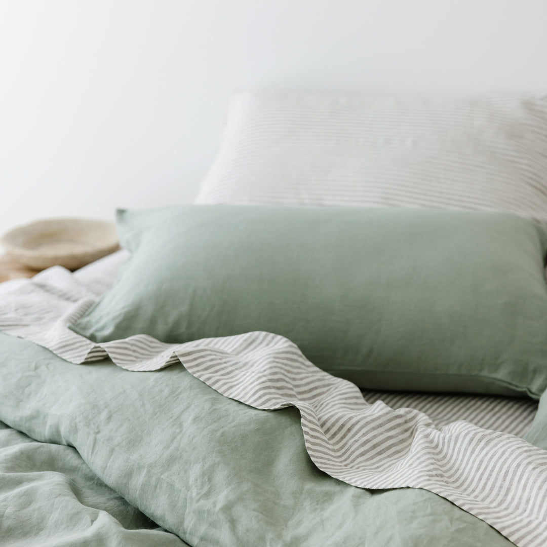 Foxtrot Home French Flax Linen styled in a bedroom with Grey Stripes Flat Sheet.