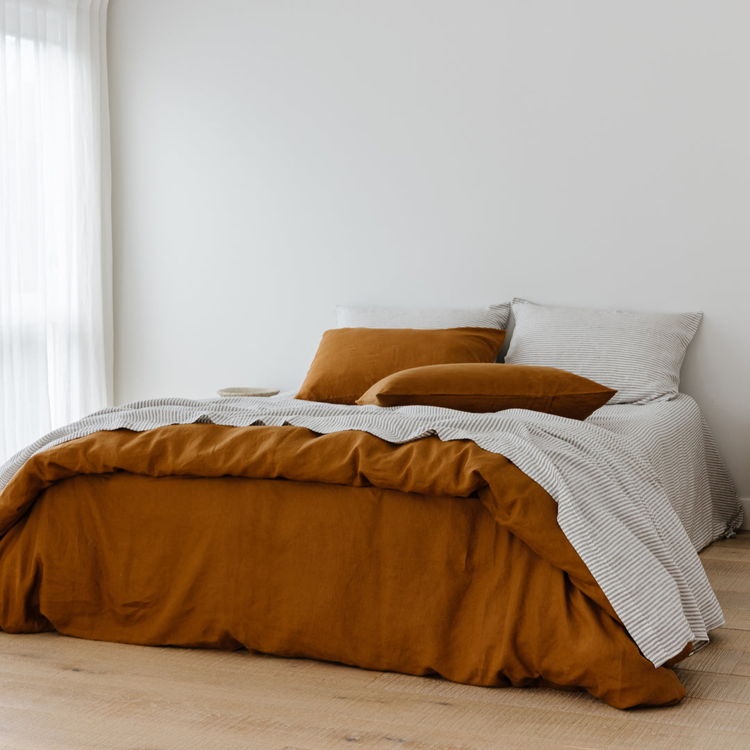 Foxtrot Home French Flax Linen styled in a bedroom with Grey Stripes Flat Sheet.