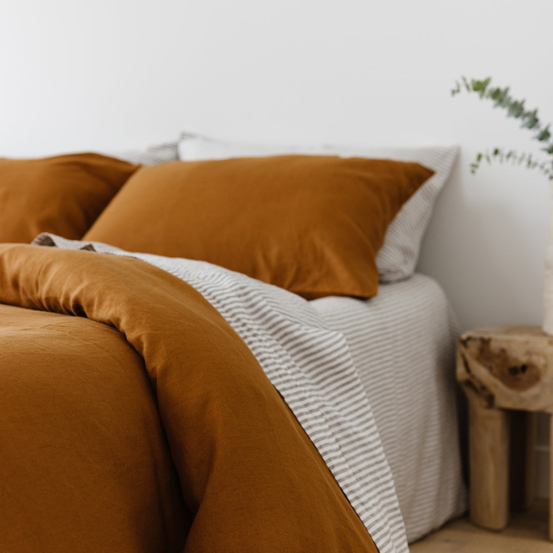 Foxtrot Home French Flax Linen styled in a bedroom with Grey Stripes Flat Sheet.