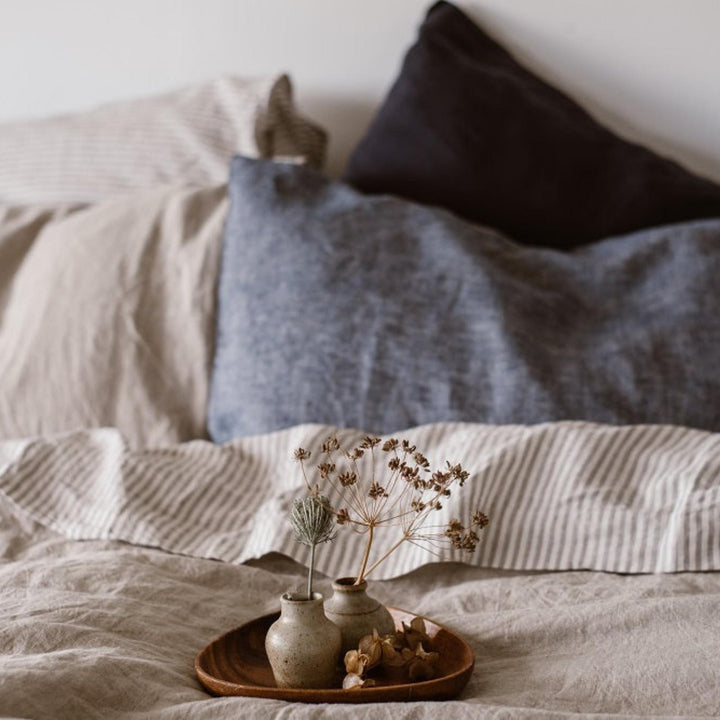 Foxtrot Home French Flax Linen styled in a bedroom with Grey Stripes Flat Sheet.