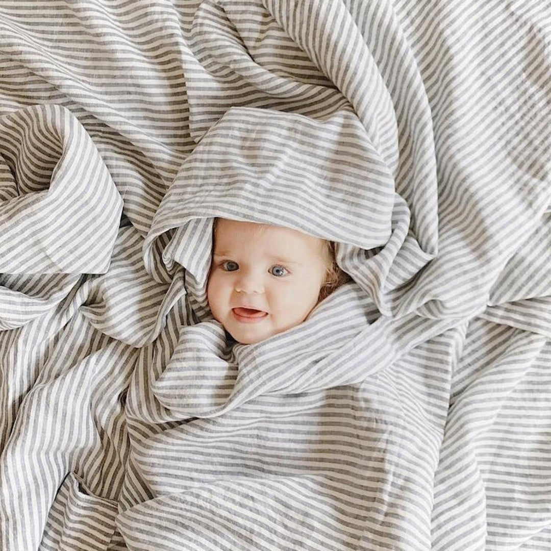 Foxtrot Home French Flax Linen styled in a bedroom with Grey Stripes Flat Sheet.