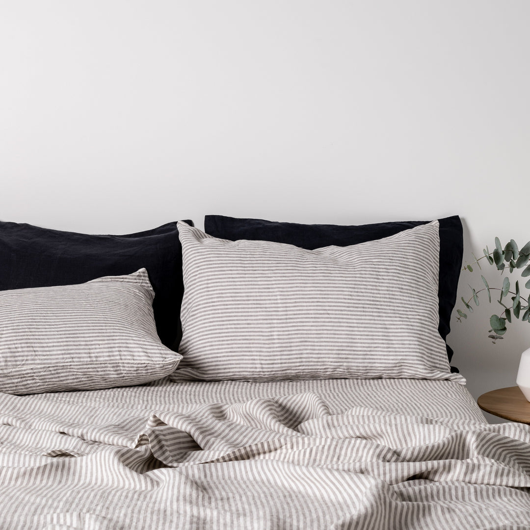 Foxtrot Home French Flax Linen styled in a bedroom with Grey Stripes Flat Sheet.