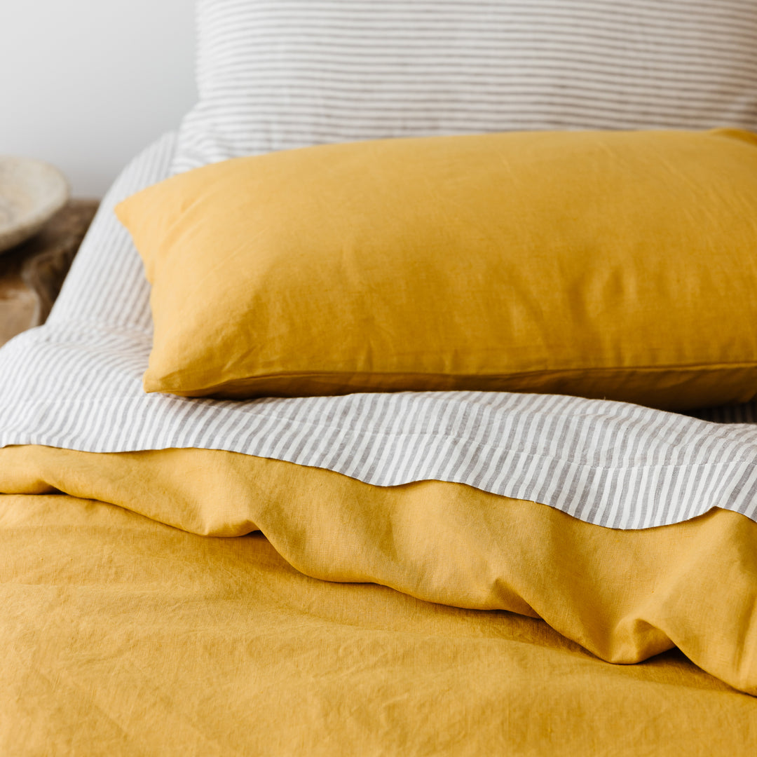 Foxtrot Home French Flax Linen styled in a bedroom with Grey Stripes Fitted Sheet.