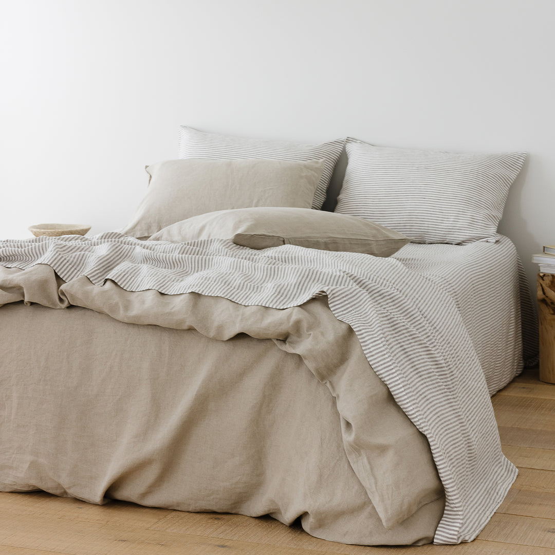 Foxtrot Home French Flax Linen styled in a bedroom with Grey Stripes Fitted Sheet.