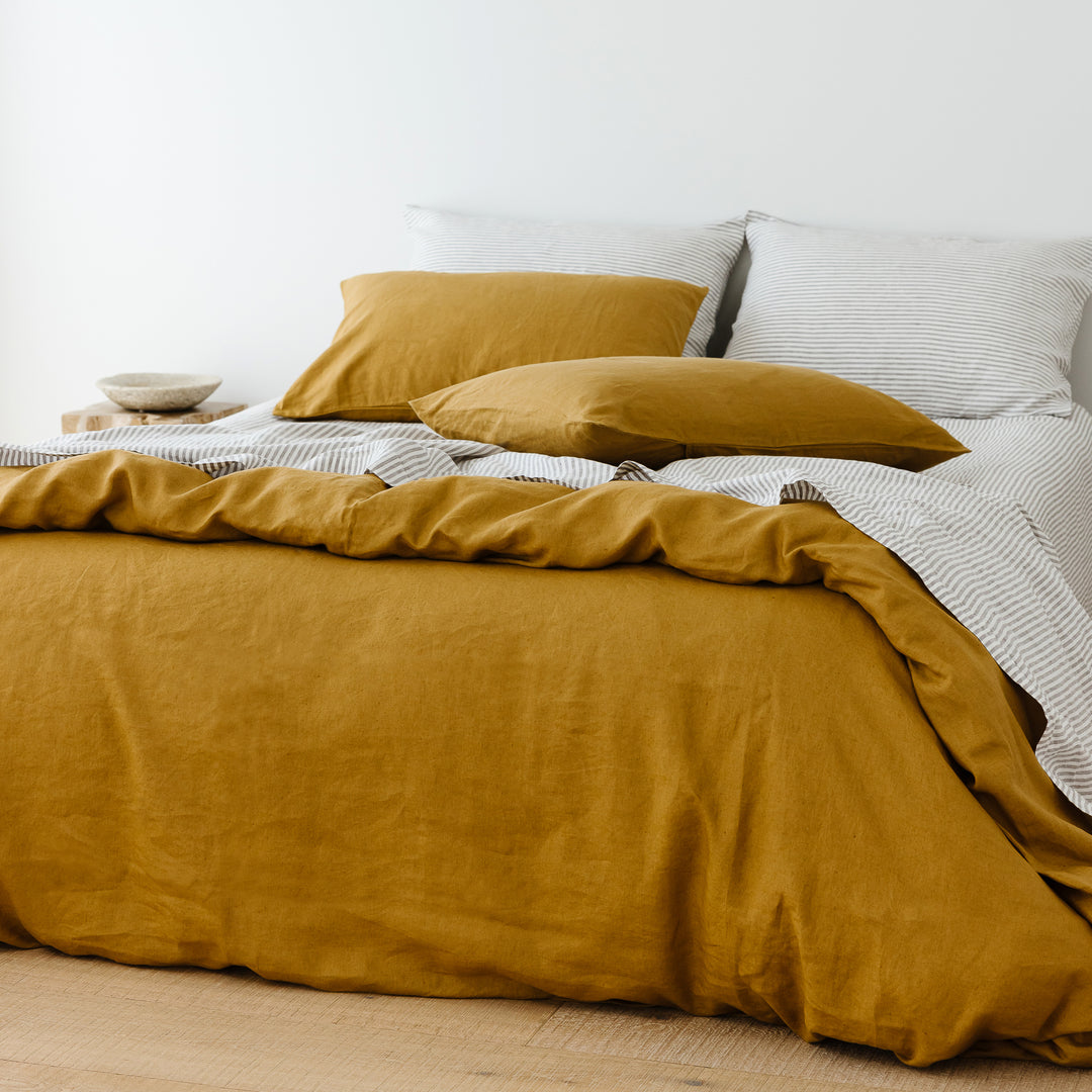 Foxtrot Home French Flax Linen styled in a bedroom with Grey Stripes Fitted Sheet.