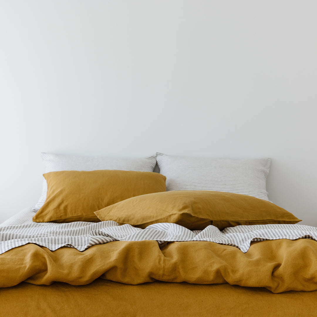 Foxtrot Home French Flax Linen styled in a bedroom with Grey Stripes Fitted Sheet.