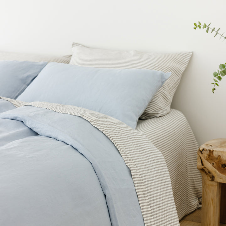 Foxtrot Home French Flax Linen styled in a bedroom with Grey Stripes Fitted Sheet.