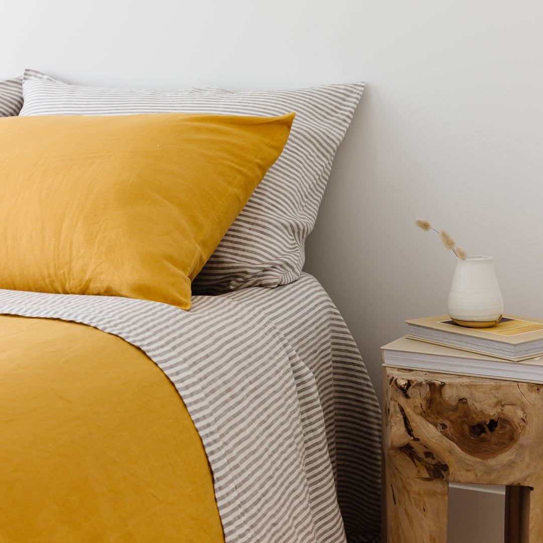 Foxtrot Home French Flax Linen styled in a bedroom with Grey Stripes Fitted Sheet.