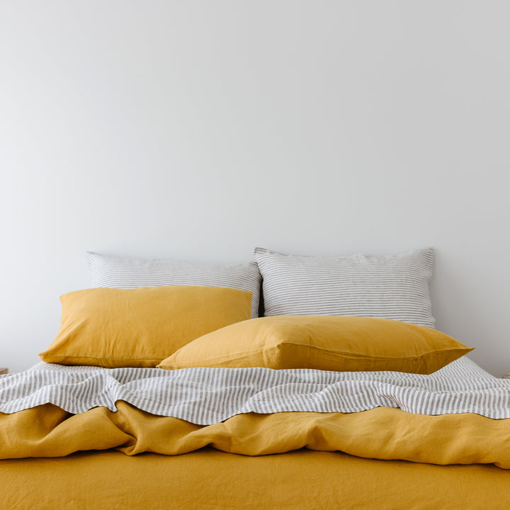 Foxtrot Home French Flax Linen styled in a bedroom with Grey Stripes Fitted Sheet.