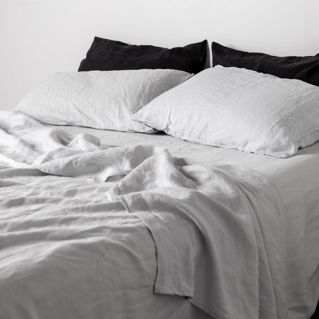 Foxtrot Home French Flax Linen styled in a bedroom with Light Grey Fitted Sheet.