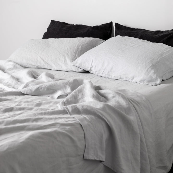 Foxtrot Home French Flax Linen styled in a bedroom with Light Grey Sheets Set.