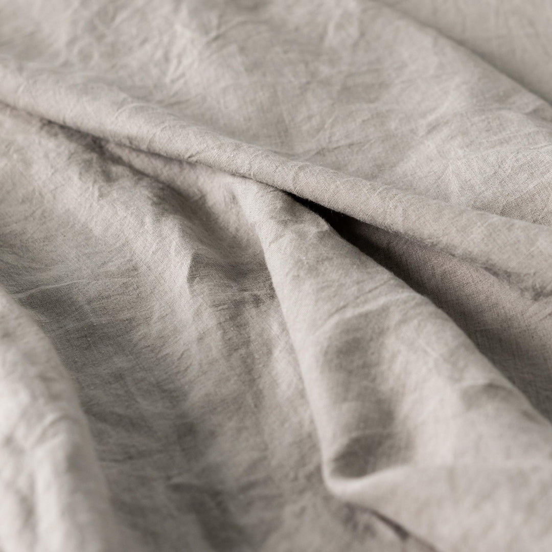 Foxtrot Home French Flax Linen styled in a baby's bedroom with a Natural Cot Duvet.