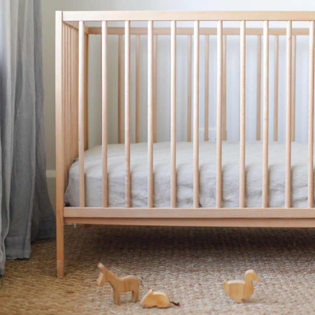 Foxtrot Home French Flax Linen styled in a baby's bedroom with a Natural Cot Duvet.