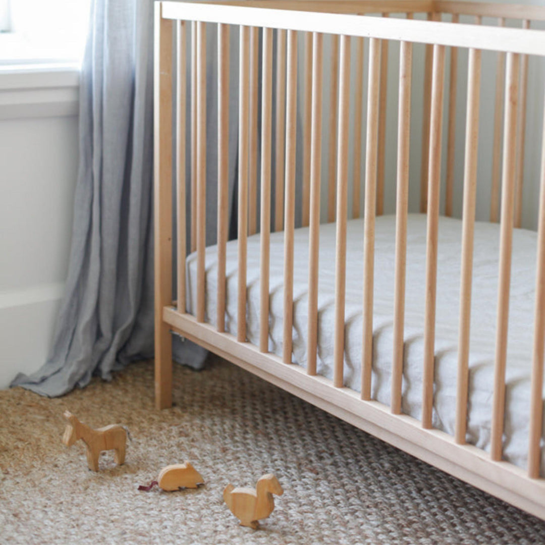 Foxtrot Home French Flax Linen styled in a baby's bedroom with a Natural Cot Duvet.